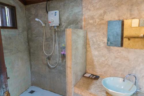 a bathroom with a shower and a sink at The Tropical Beach Resort in Ko Chang