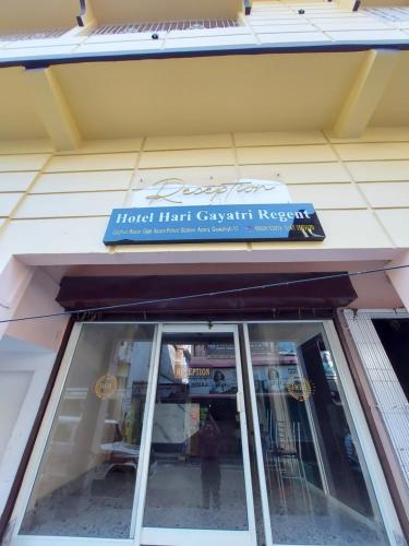 a sign over a window of a store at Hotel Hari Gayatri Regent in Guwahati