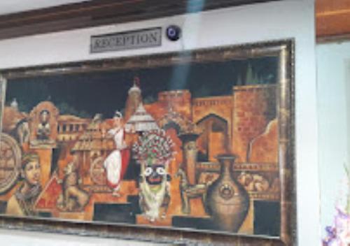 een schilderij van vazen en vazen aan een muur bij Hotel Shubham Odisha in Rourkela