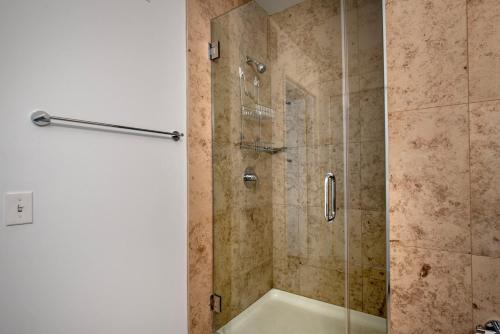 a bathroom with a shower with a glass door at Streeterville 1br w terrace gym nr riverwalk CHI-997 in Chicago