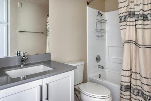 a bathroom with a sink and a toilet and a shower at Rancho Penasquitos 1br w pool gym nr bars SAN-31 in San Diego