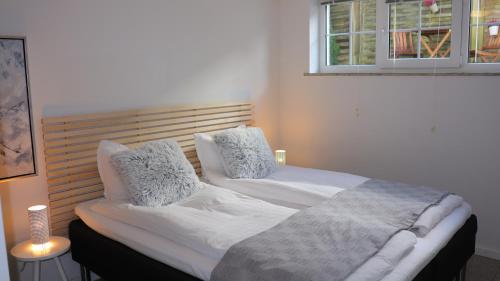 En eller flere senge i et værelse på Luksus lejligheder i Ikast, tæt ved Herning, Silkeborg og Århus