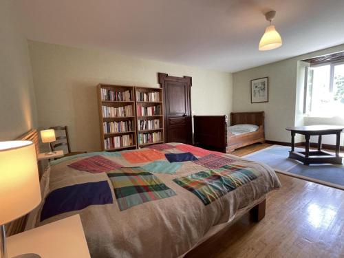 a bedroom with a bed and a book shelf at Saint marty in Montory