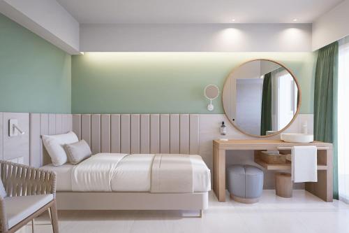 a small bedroom with a bed and a mirror at Bordoy Cosmopolitan in Playa de Palma