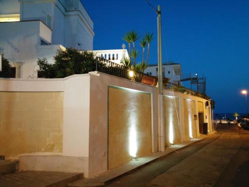 a building with lights on the side of a street at B&B Stellamarina in Pulsano