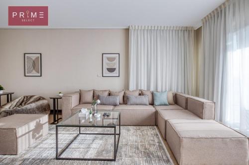 a living room with a couch and a table at Prime Select New Giza in Giza