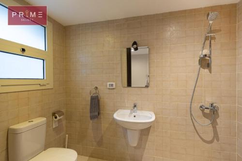 a bathroom with a sink and a toilet and a shower at Prime Select New Giza in Giza