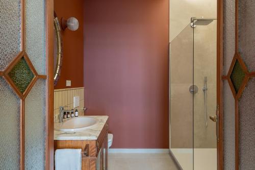 a bathroom with a sink and a shower at La Novieta Boutique Hotel - Adults Only in Valencia