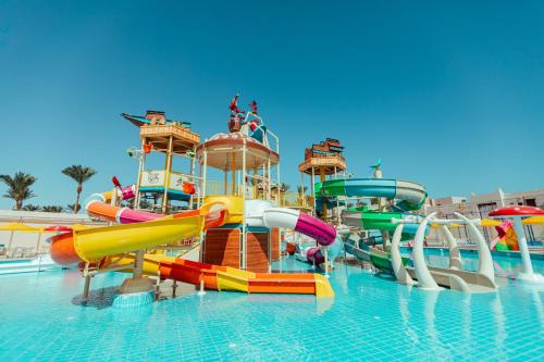 a water park with a water slide in the water at Pickalbatros The Palace Port Ghalib in Port Ghalib
