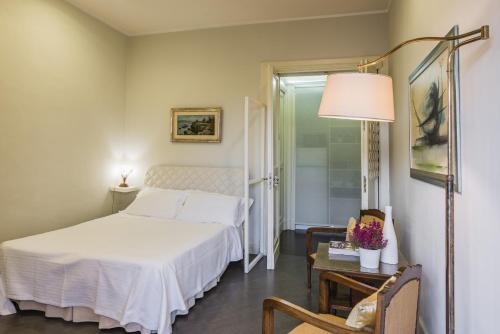 Krevet ili kreveti u jedinici u objektu Mini Appartamento Fischetti by Wonderful Italy