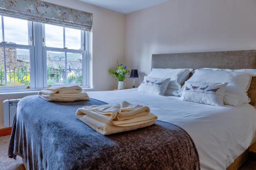 Katil atau katil-katil dalam bilik di Howgills Apartments