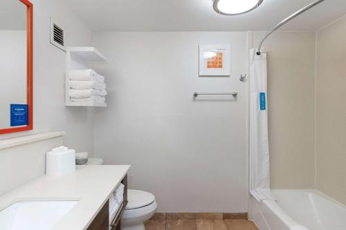 a white bathroom with a shower and a toilet at Hampton Inn Rock Hill in Rock Hill
