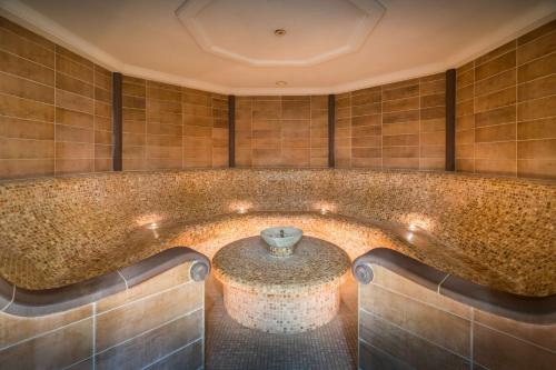 a large bath tub with a table in the middle at Barceló Costa Ballena Golf & Spa in Costa Ballena