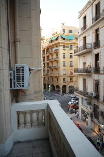 a view of a city street from a balcony at Hathor House in Cairo