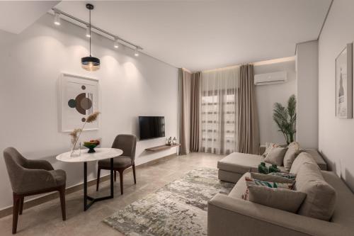 a living room with a couch and a table at Livingville Nine in Cairo