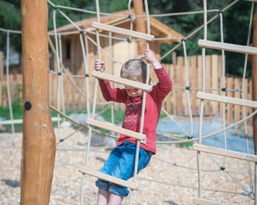 a young child is playing on a playground at Stockhambauer in Kleinarl