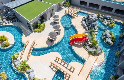 an aerial view of a pool at a resort at Utopia Naiharn in Nai Harn Beach