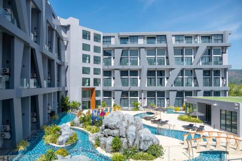 an aerial view of an apartment complex with a swimming pool at Utopia Naiharn in Nai Harn Beach