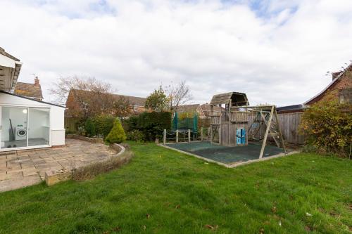 a yard with a playground in a house at Seaside Haven for all the family in Marske-by-the-Sea