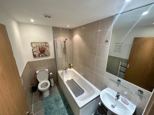 a small bathroom with a toilet and a sink at London Bridge apartment in London