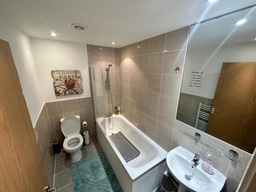 a small bathroom with a toilet and a sink at London Bridge apartment in London