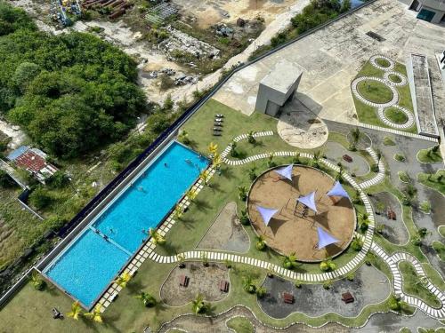 an overhead view of a pool with a resort at CC Suites Jesselton Quay - Seaview - 2Bedroom in Kota Kinabalu