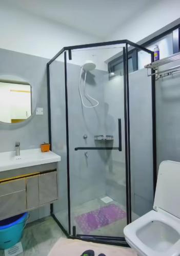 a bathroom with a shower and a sink at The place rich in Nairobi