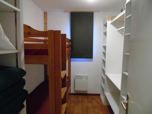 a small room with a bunk bed and a chalkboard at Appartement Valfréjus, 4 pièces, 8 personnes - FR-1-561-45 in Valfréjus