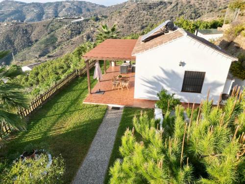 an aerial view of a house with mountains in the background at Vela Luka Frigiliana in Frigiliana