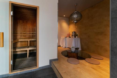 a dining room with a table and a table at Admiral Park Hotel by Falco D'Oro Hotels in Zola Predosa