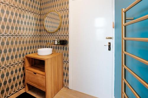 a bathroom with a sink and a mirror at Albert Road Apartments Room 1 in Colne