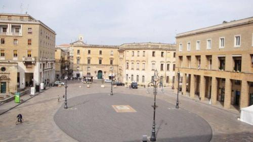 a large courtyard in a city with buildings at Trilogy Prestige - Central Premium Suites in Lecce