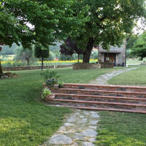 a set of stairs in a park with flowers at Azienda Agrituristica I Tre Casali in Magione