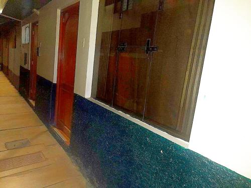 a hallway of a building with a glass wall at Cruz Apartments - Centro Histórico de Cusco in Cusco