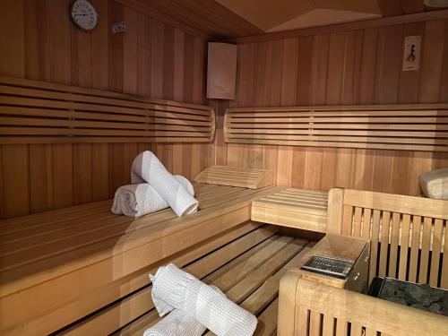 a sauna with two towels sitting in it at Chalet Toda in Lech am Arlberg