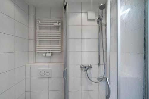 a shower with a glass door in a bathroom at Sonnenidyll in Westerland