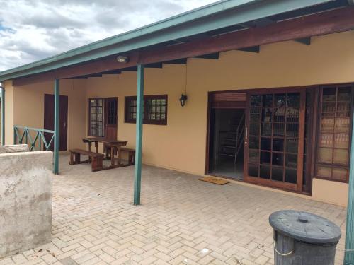 a building with a porch and a patio at Unit 89 Pendleberry Holiday Resort in Bela-Bela