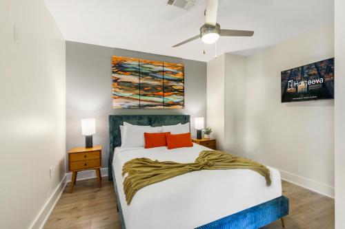 a bedroom with a bed and a ceiling fan at The Big Easy's Finest: 4-BR Luxury Condo in NOLA in New Orleans