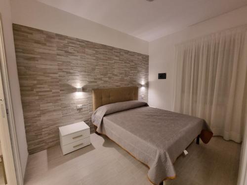 Giường trong phòng chung tại I Gerani appartamento bilocale deluxe