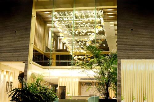 a building with a chandelier hanging from the ceiling at BluSalzz Residence Amritsar in Amritsar