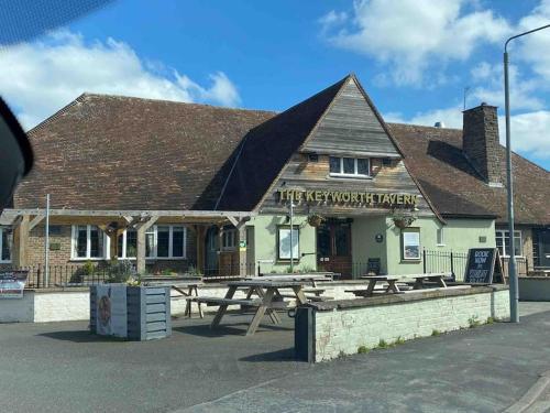 a pub with a picnic table in front of it at Spacious lovely 3 Bed House in Keyworth Nottingham suit CONTRACTORS OR FAMILY in Keyworth