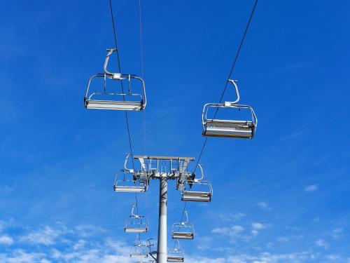 a ski lift with two empty chairs on it at Chalet Peter in Zell am See