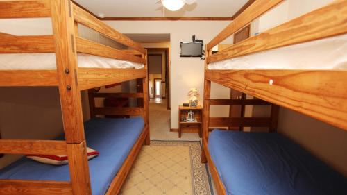 two bunk beds in a room with a hallway at Semi-Oceanfront, Close to Beach, Dogs Welcome, SA8, Berry in Sanderling