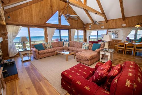 a living room with couches and a table and chairs at OCEANFRONT, Ocean views, Quiet area, SA183, Ocean Island in Sanderling