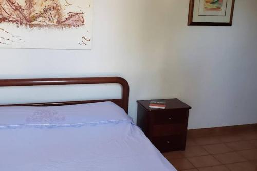 Tempat tidur dalam kamar di Condomínio em frente à linda praia de Massaguaçu - Caraguatatuba - Litoral Norte SP