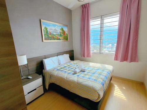 a small bedroom with a bed and a window at Windmill Pemium 2-bedrooms at Genting High Floor Free WiFi in Genting Highlands