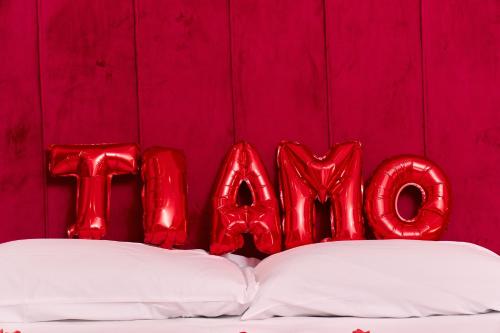 a group of red balloons spelling out the word love at Hotel Melydà in Pozzuoli