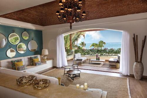 a living room with a view of the ocean at Azul Villa Casa del Mar - Gourmet All Inclusive by Karisma in Puerto Morelos