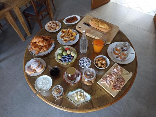 a table with a bunch of breakfast foods on it at VILLA ADRIANA in Bra