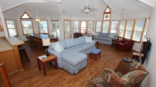 a living room with a couch and a table at Oceanside, Private Pool, Community Pool, Sun Deck, SP8, Ole Duck Haven in Duck